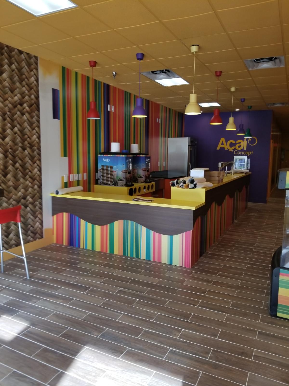 Completed commercial retail build-out with pendant lighting and custom service counter