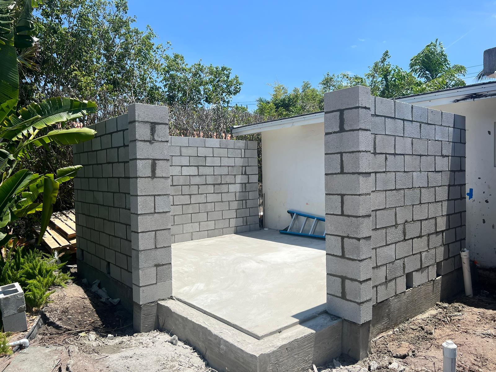 New concrete block walls and finished slab for a home addition