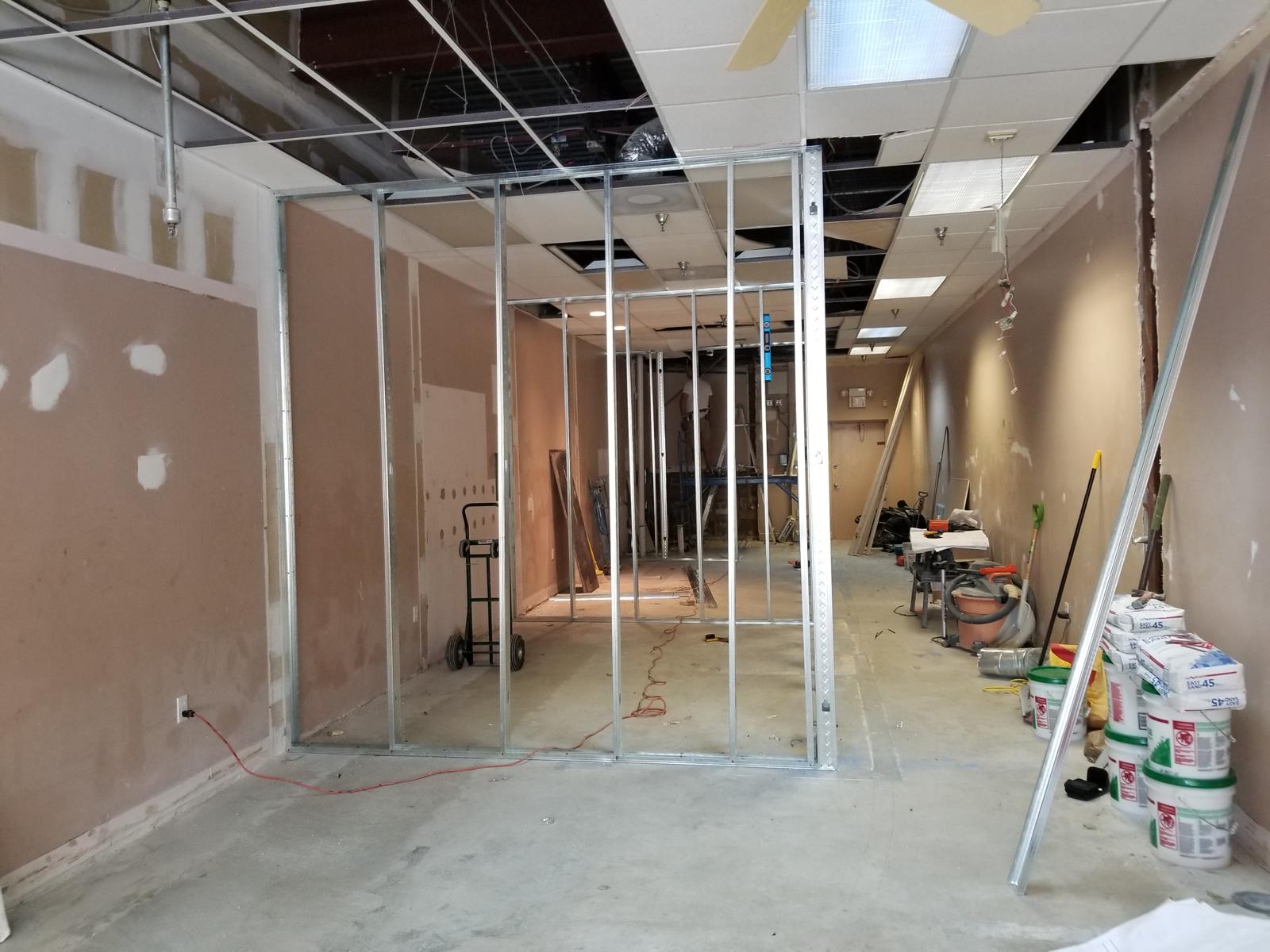 Metal stud framing forming a new room inside a commercial unit