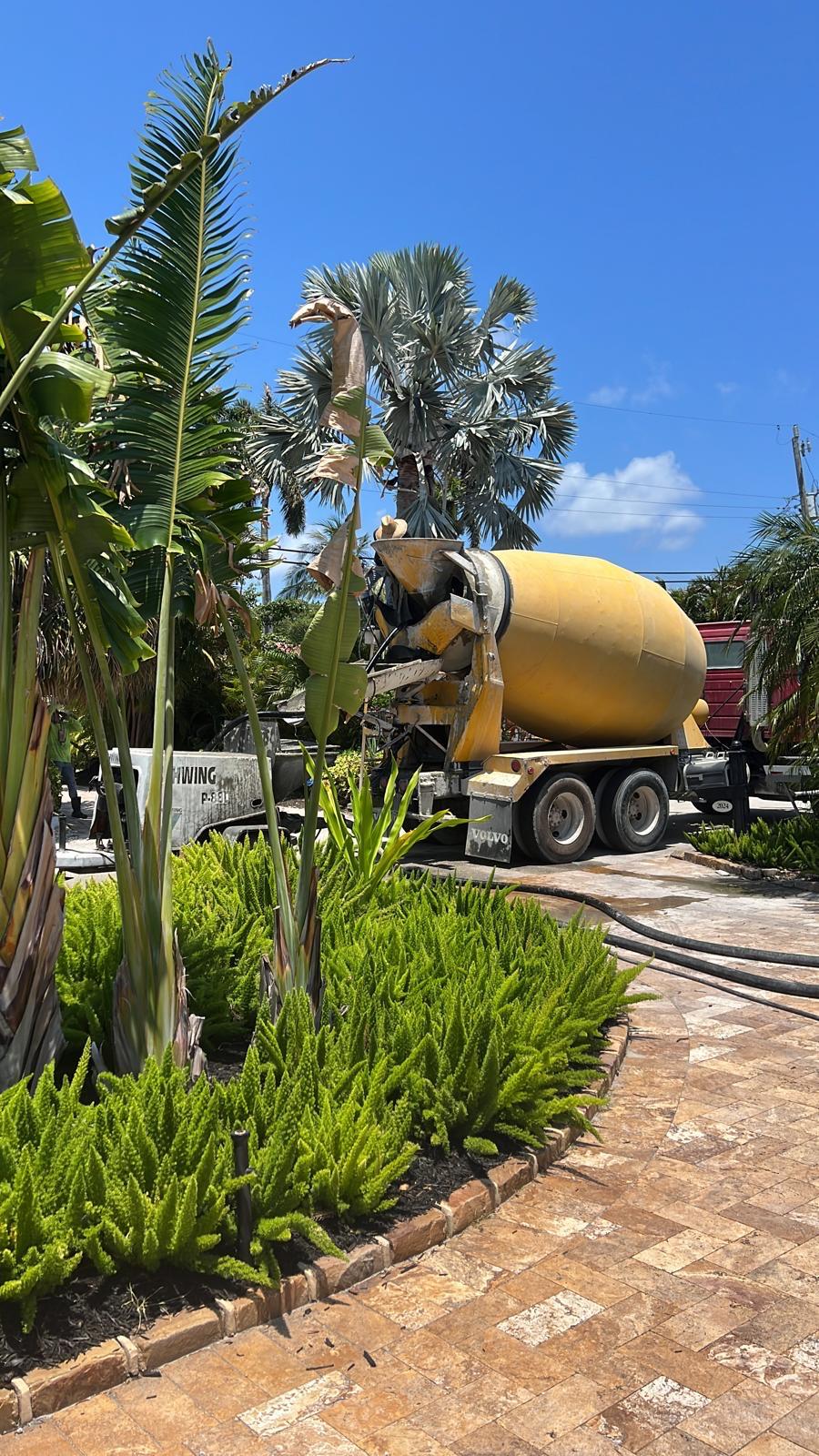 Concrete mixer truck delivering slab concrete at a South Florida home addition