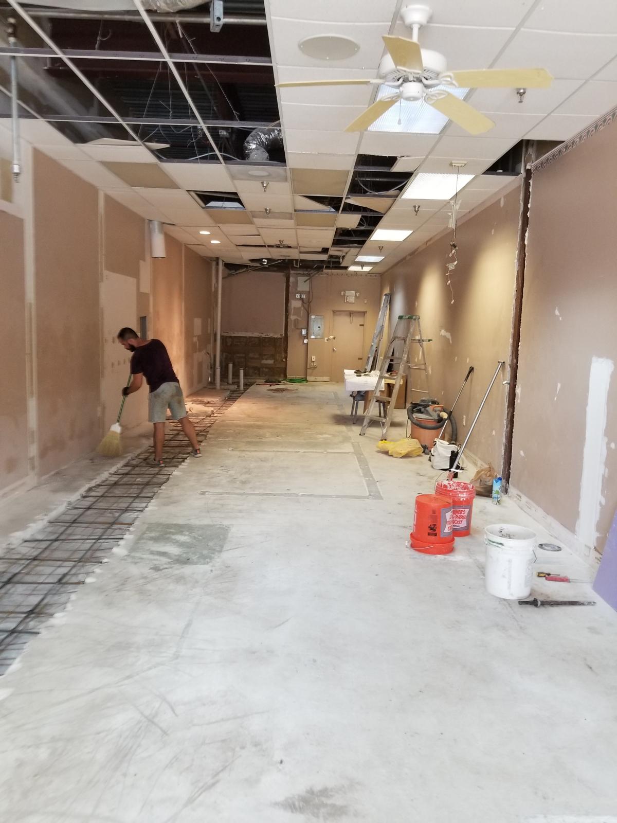 Commercial space demolition with slab trenching and rebar for plumbing rough-in